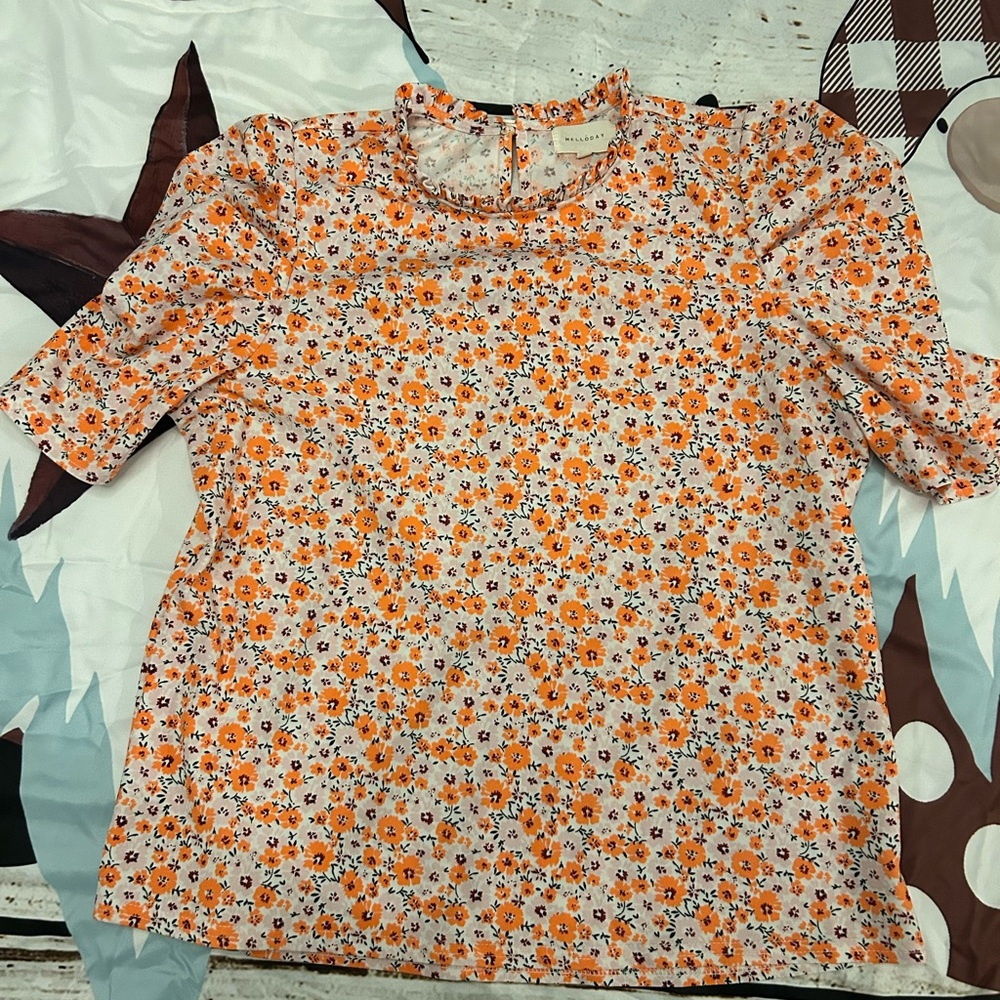 Orange flowered, demure, gathered sleeves and collar. Melloday medium. 22” back